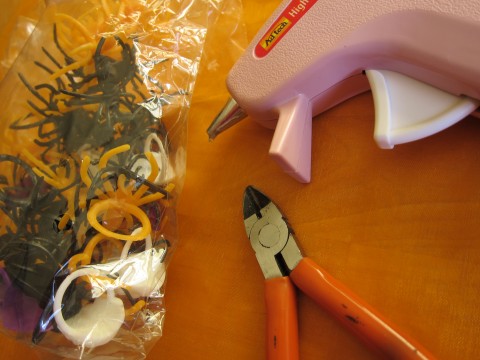 Plastic rings, wire cutters, hot glue gun
