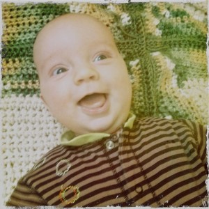 Samuel smiling at three months