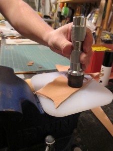 Cutting out leather buttons