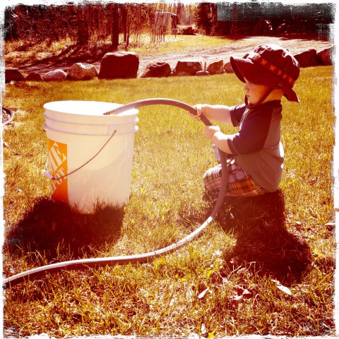 Sam filling water bucket