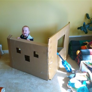 Sam in his cardboard fort