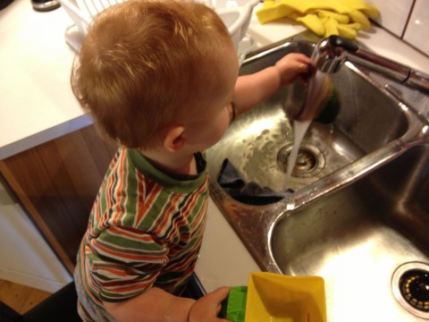 Sam playing in sink