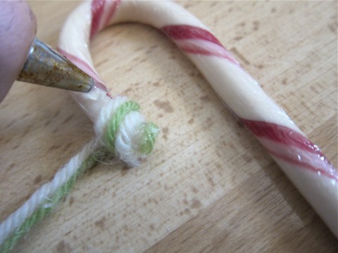 Glue yarn to candy cane