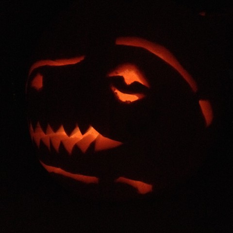 Now that we're home, we get to celebrate *actual* Halloween, starting with pumpkin carving. This one was requested by our dino-crazed boy and lovingly carved by his daddy.