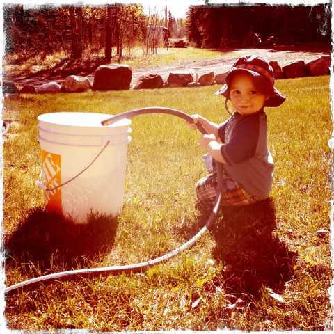 Sam filling bucket with water