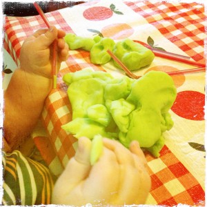 Sam playing with homemade play dough & straws