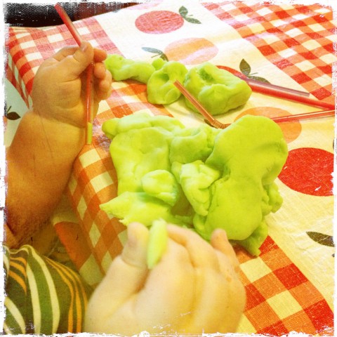 Sam playing with homemade play dough & straws