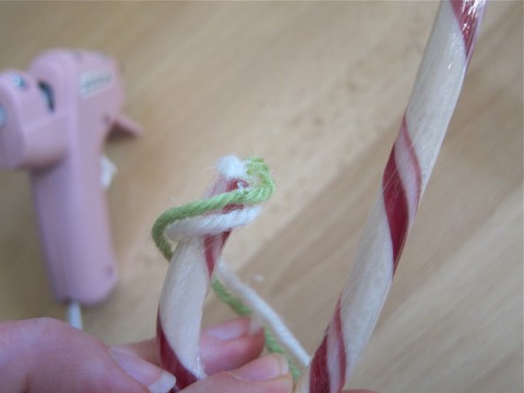 Begin attaching yarn to candy cane